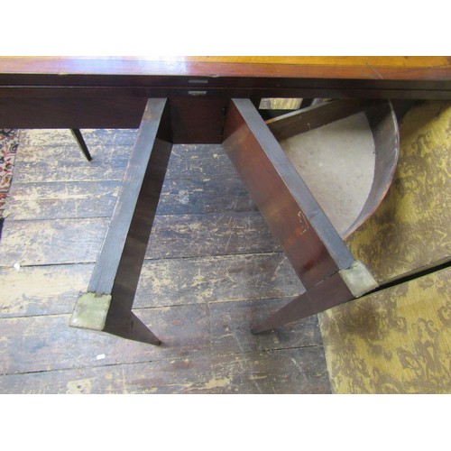 2706 - A 19th century mahogany D end fold-over top tea table crossbanded in satinwood and raised on square ... 