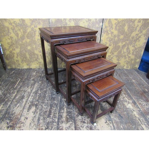 2668 - A nest of four 20th C Chinese tables of graduated form in a traditional style.
51cm maximum