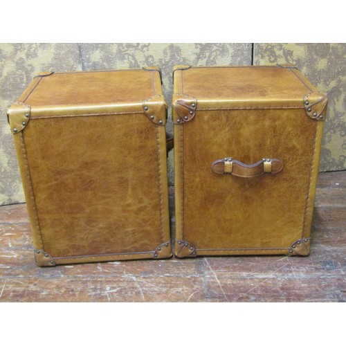 2656 - A pair of studded tan leather three drawer bedside chests