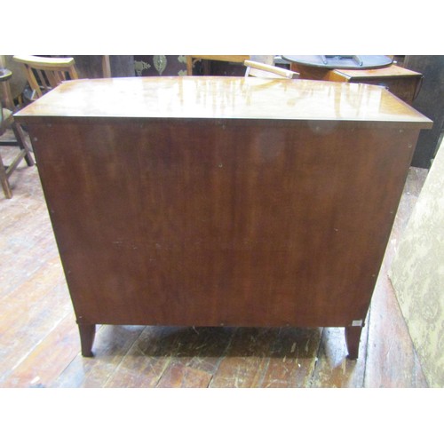 2660 - A reproduction walnut bow-fronted cabinet, the front elevation enclosed by two doors with brass gril... 