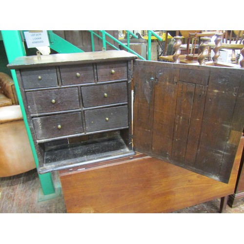 2662 - 18th century oak wall cupboard with carved detail, the interior fitted with an arrangement of seven ... 