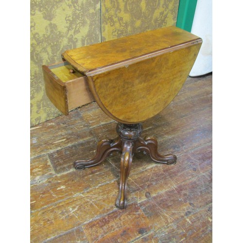 2642 - A small Victorian burr walnut folding tea table enclosing a frieze drawer with segmented compartment... 