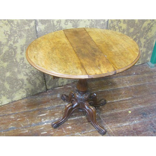 2642 - A small Victorian burr walnut folding tea table enclosing a frieze drawer with segmented compartment... 