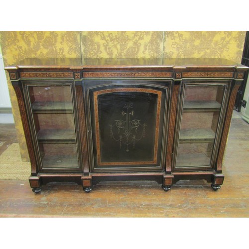 2640 - A Victorian ebonised three door credenza cabinet with amboyna wood highlights, two glazed panelled o... 