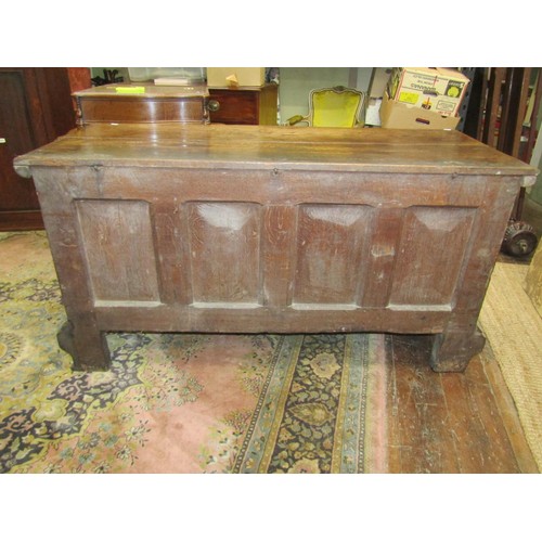 2634 - 17th century large carved oak coffer, the front elevation enclosed by four rectangular panels with r... 