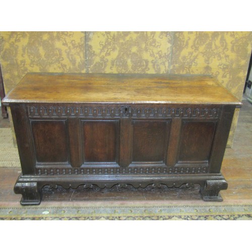 2634 - 17th century large carved oak coffer, the front elevation enclosed by four rectangular panels with r... 