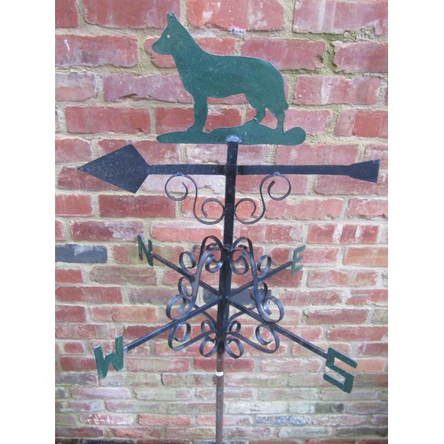 2040 - A partially painted weather vane, topped with finial in the form of a dog, 78cm high