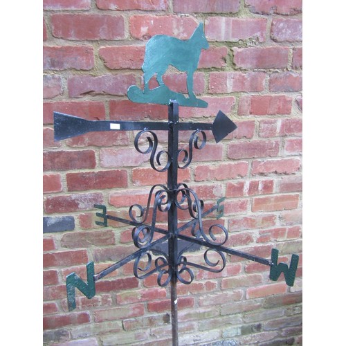 2040 - A partially painted weather vane, topped with finial in the form of a dog, 78cm high