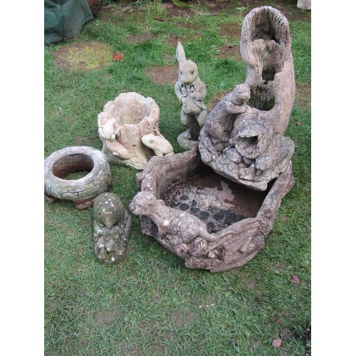 2086 - A weathered composition stone water feature in the form of an otter and habitat together with other ... 