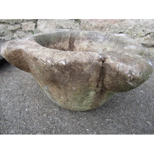 2102 - A weathered stone mortar (32cm diameter) and a cast iron boot scraper (2)