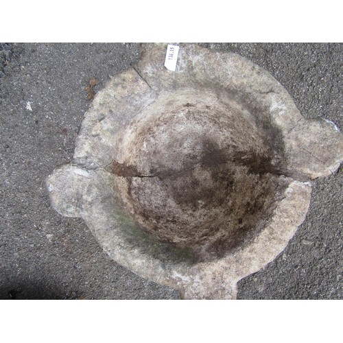 2102 - A weathered stone mortar (32cm diameter) and a cast iron boot scraper (2)