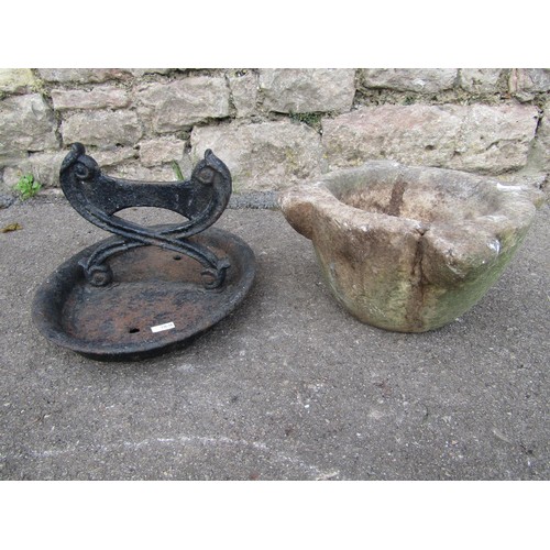 2102 - A weathered stone mortar (32cm diameter) and a cast iron boot scraper (2)