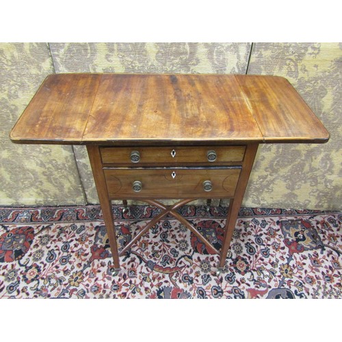 2641 - A regency mahogany ladies sewing table, two frieze drawers enclosed within drop leaves raised on squ... 