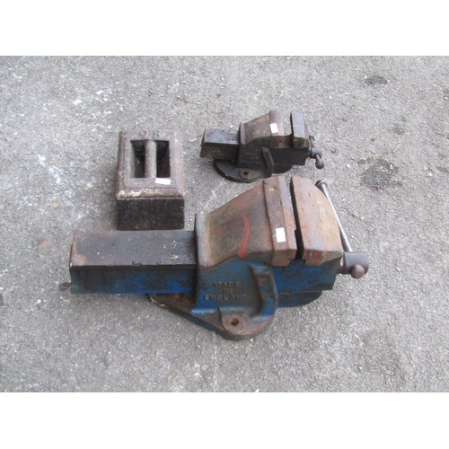 2112 - Two bench vices together with cast iron weight (3)