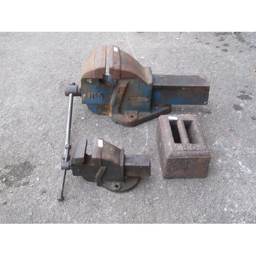 2112 - Two bench vices together with cast iron weight (3)