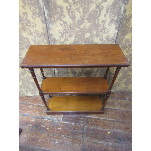 2643 - Edwardian mahogany three tier side table, raised on tapered square cut supports, on a plinth base wi... 