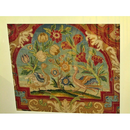 83 - A later framed 19th century embroidered tapestry panel decorated with a pair of Asiatic birds flanki... 