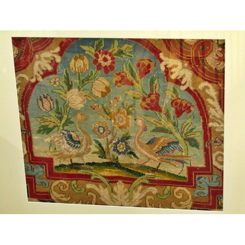 83 - A later framed 19th century embroidered tapestry panel decorated with a pair of Asiatic birds flanki... 