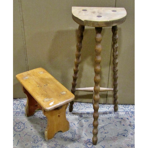 2262 - A small pine tablet-top stool, together with a further taller example with turned bobbin supports (2... 