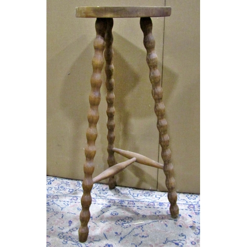 2262 - A small pine tablet-top stool, together with a further taller example with turned bobbin supports (2... 