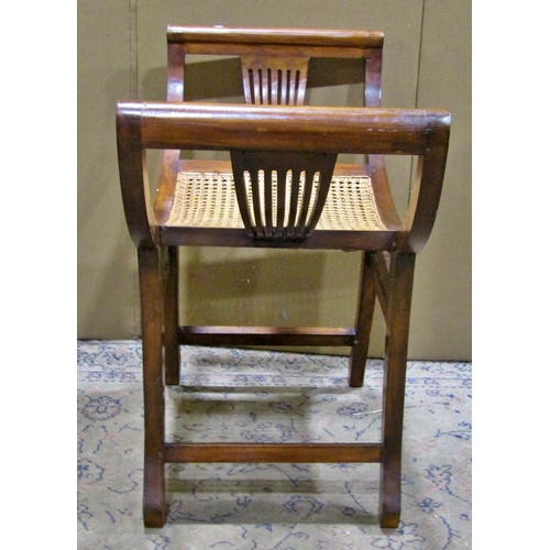 2264 - An x framed bergere seated piano stool, 69 cm high.