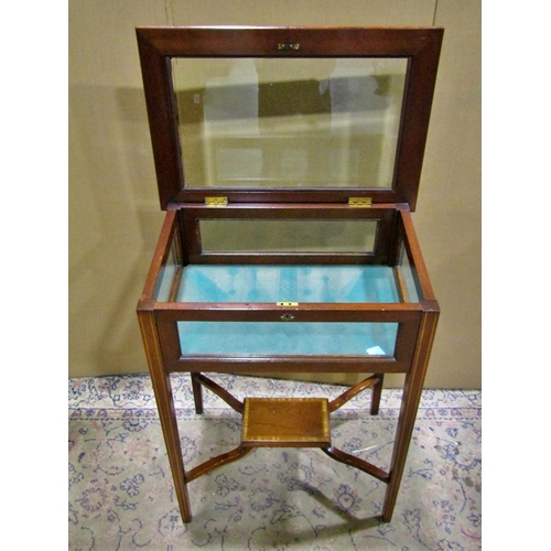 2268 - An Edwardian Inlaid mahogany vitrine, with a locking hinged bevelled cover and glazed panelled sides... 