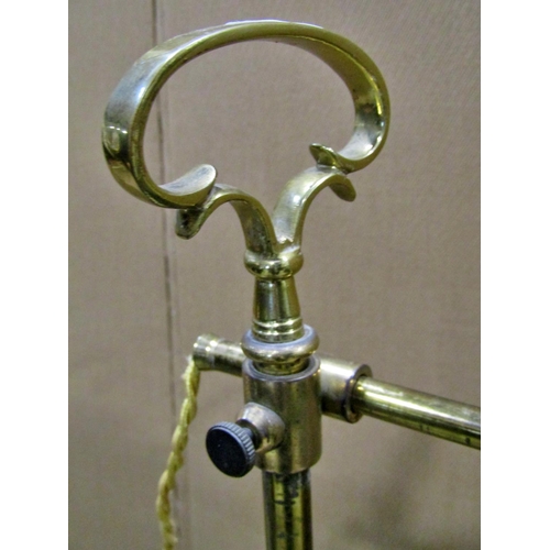 2303 - An Edwardian adjustable brass standard / reading lamp, 104cm