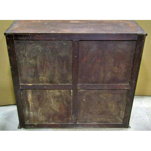 2298 - A small late 19th /early 20th century mahogany cabinet, the glazed panelled doors opening to reveal ... 