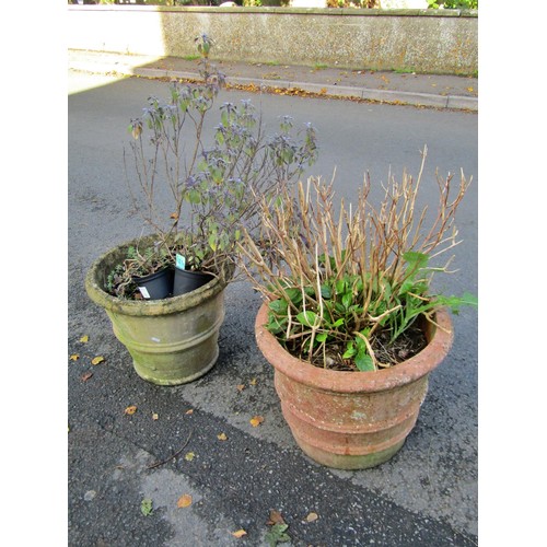 2063 - A weathered terracotta circular ribbed planter with moulded rim 58 cm diameter x 42 cm high together... 