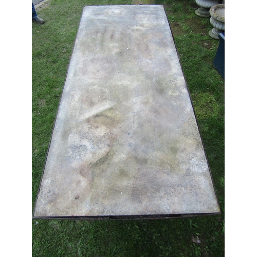 2094 - A large weathered  ironwork table with scrolled framework and inset marble top, 75cm high, 197 long ... 