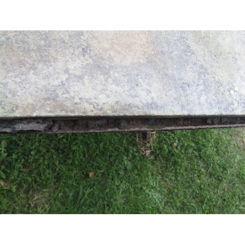 2094 - A large weathered  ironwork table with scrolled framework and inset marble top, 75cm high, 197 long ... 