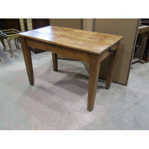 2242 - A small rustic scrubbed, pine farmhouse table, with planks top above a single frieze drawer, 71 cm h... 