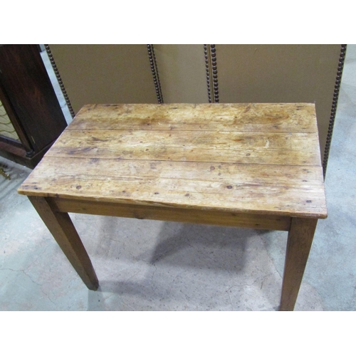 2242 - A small rustic scrubbed, pine farmhouse table, with planks top above a single frieze drawer, 71 cm h... 