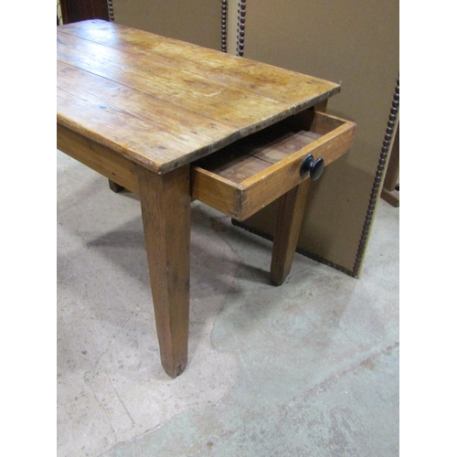 2242 - A small rustic scrubbed, pine farmhouse table, with planks top above a single frieze drawer, 71 cm h... 