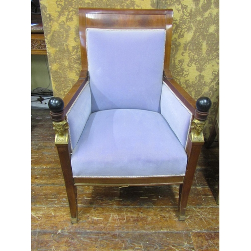 2652 - A pair of Empire style elbow chairs, raised on sabre supports, the show wood frames mounted with ebo... 