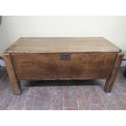 2730 - An early oak  plank coffer on raised supports
140cm wide