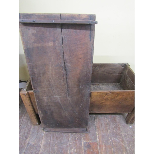 2730 - An early oak  plank coffer on raised supports
140cm wide