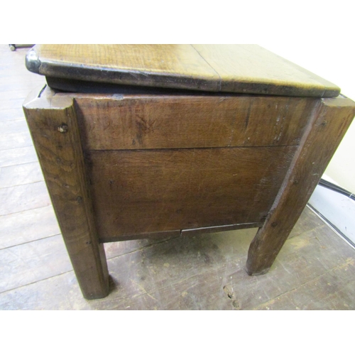 2730 - An early oak  plank coffer on raised supports
140cm wide