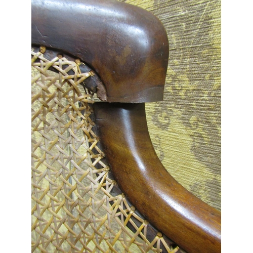 2740 - Regency mahogany bergere library chair on fluted supports