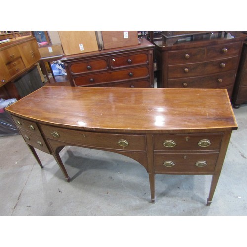 2266 - A very large 19th century bow-fronted mahogany sideboard, the banded top over an arrangement of draw... 