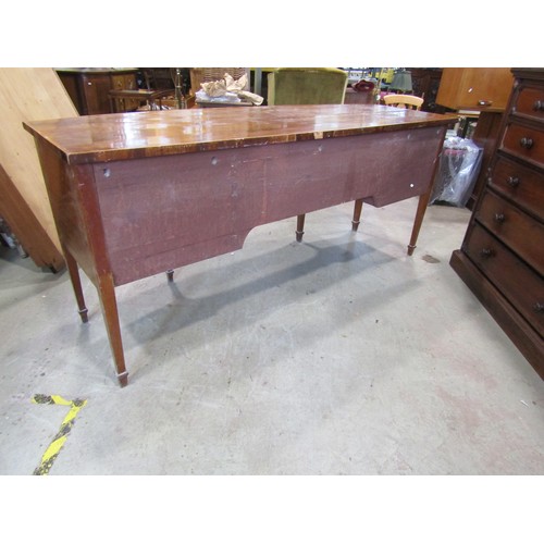 2266 - A very large 19th century bow-fronted mahogany sideboard, the banded top over an arrangement of draw... 