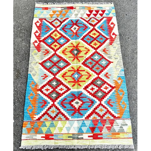 1790 - Chobi kilim with a multi coloured over all geometric pattern 128 x80cm approx.