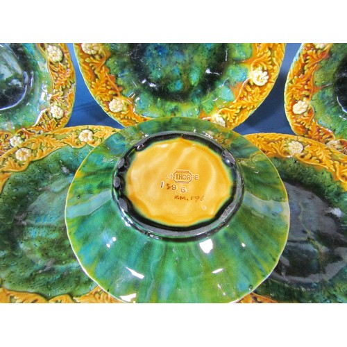 1015 - Eight Linthorpe majolica moulded plates, shape no 1896, with impressed marks to undersides, 21cm in ... 