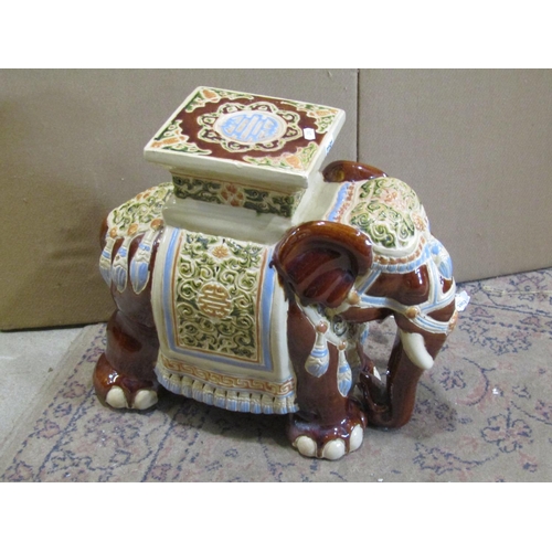 2191 - A Chinese style ceramic garden seat in the form of an elephant with sancai style glazed finish, 42cm... 