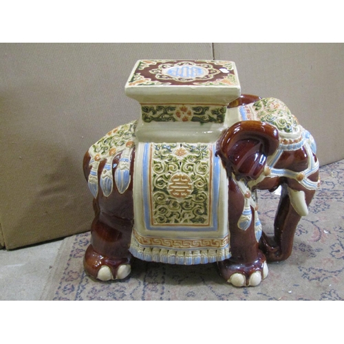 2191 - A Chinese style ceramic garden seat in the form of an elephant with sancai style glazed finish, 42cm... 