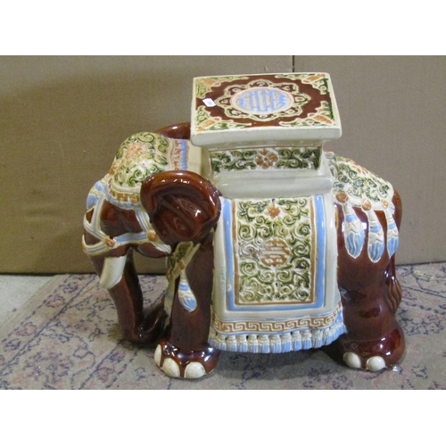 2191 - A Chinese style ceramic garden seat in the form of an elephant with sancai style glazed finish, 42cm... 