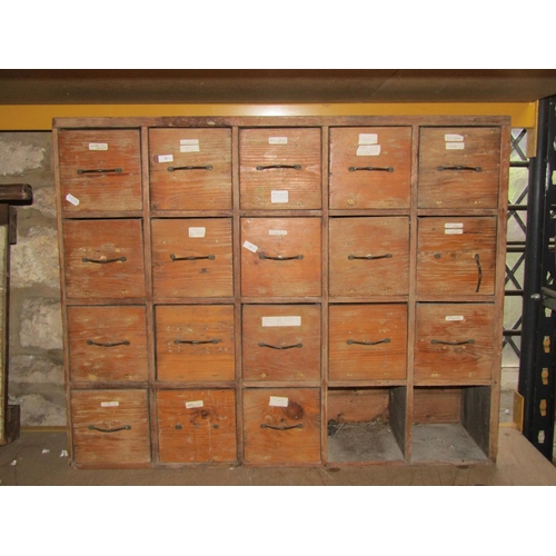 2192 - An early 20th century pine bank of twenty pigeonhole drawers, 68cm high, 84 x 21cm