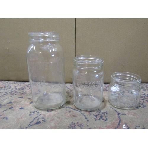 2193 - A collection of Kilner storage jars of varying size together with a quantity of pub pint glasses