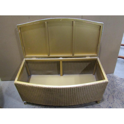 2231 - Three Lloyd Loom items with a gold painted finish, to include a chair, ottoman and laundry box toget... 