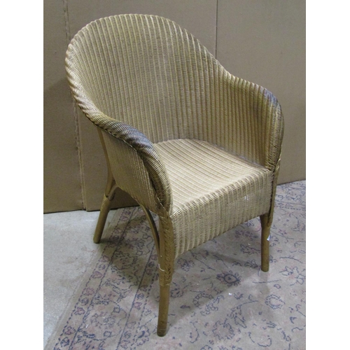 2231 - Three Lloyd Loom items with a gold painted finish, to include a chair, ottoman and laundry box toget... 